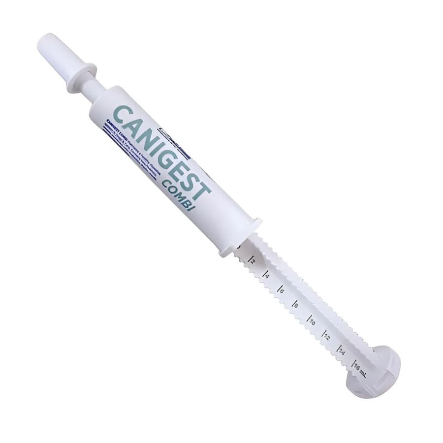 Jeringa dosificadora de Canigest Combi 32 ml con pasta oral, graduada para medir la dosis por peso