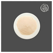 Textura cremosa del puré de atún con glucosamina Kit Cat Purr Puree Plus Joint Care servida en un plato blanco